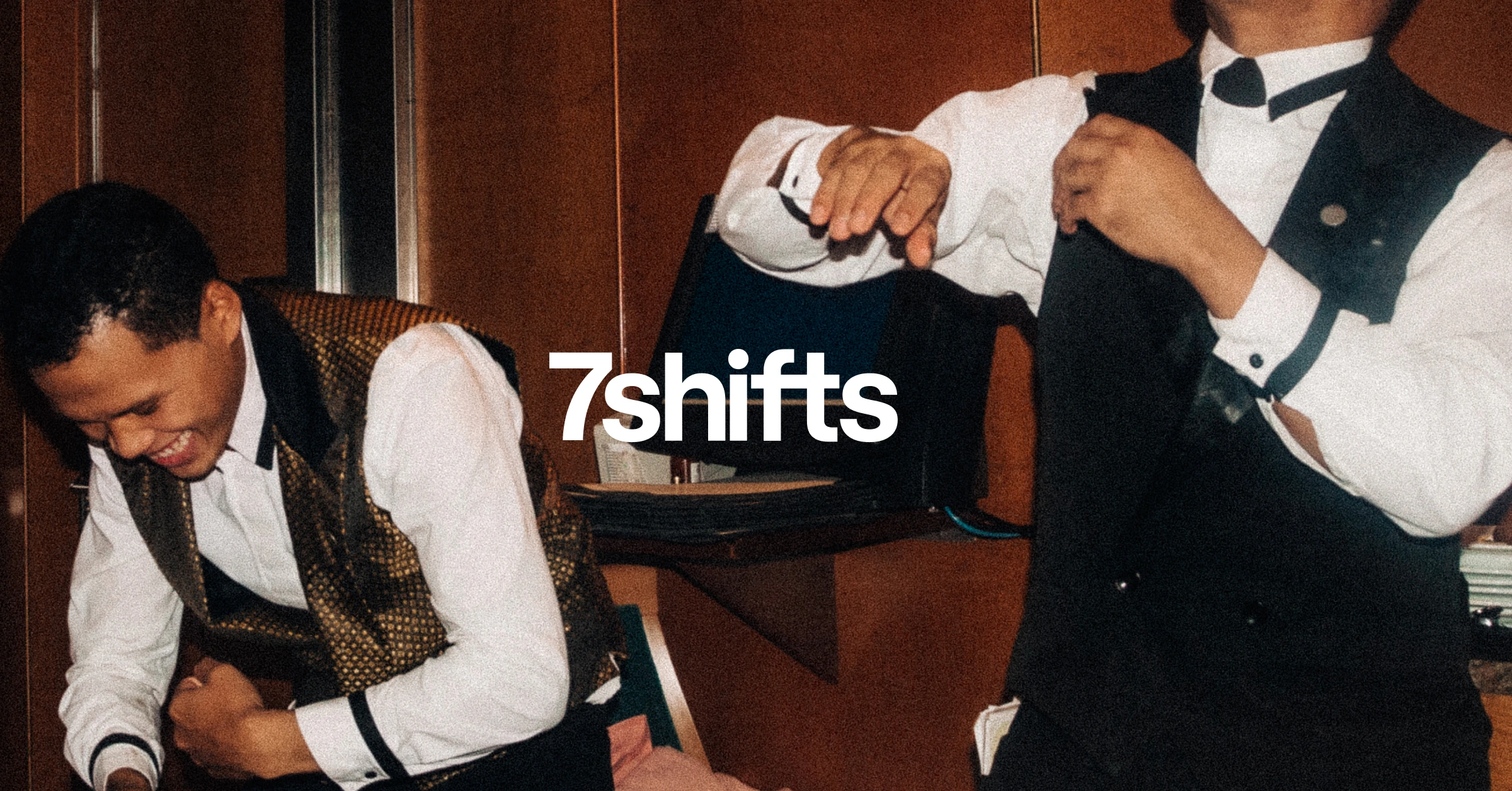 Two male servers in suits.